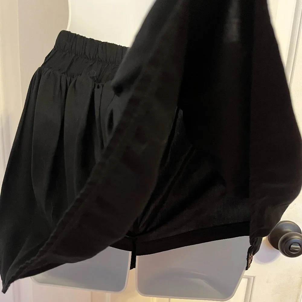 Justice black skort with silver sparkly trim along waistline and hem sz 12